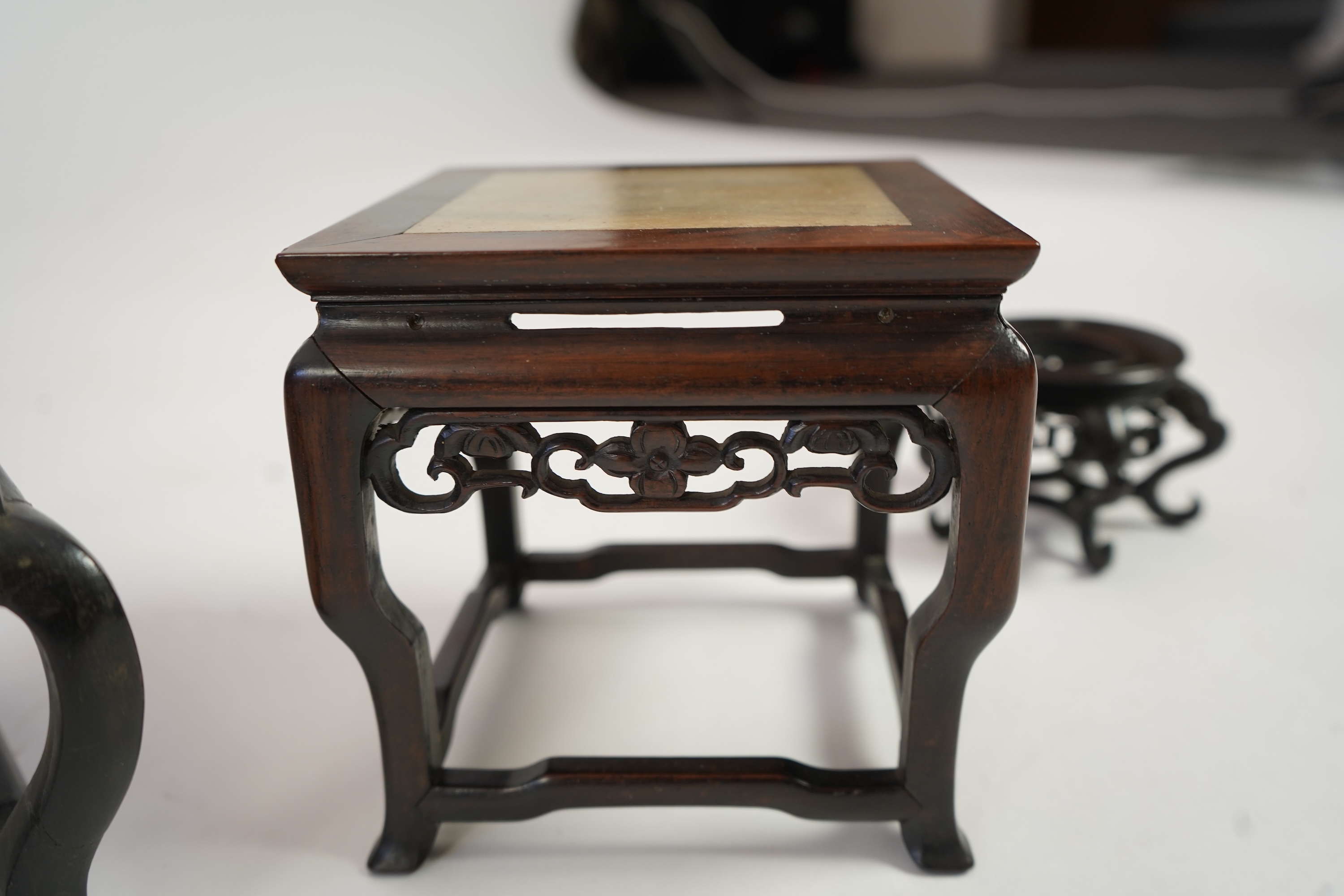 A group of sixteen Chinese hardwood stands together with a Japanese stand, 19th/20th century